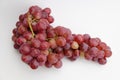 Fresh and ripe red grapes isolated in white background. Bunch of raw and juicy grapevines Royalty Free Stock Photo