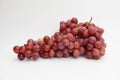 Fresh and ripe red grapes isolated in white background. Bunch of raw and juicy grapevines Royalty Free Stock Photo