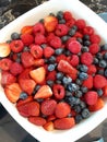 Fresh ripe red strawberries and blueberries in sieve Royalty Free Stock Photo