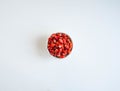 Fresh ripe red wild strawberries in a white ceramic bowl on a white background. Top view Royalty Free Stock Photo