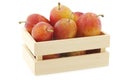 Fresh ripe red and yellow plums in a wooden box Royalty Free Stock Photo