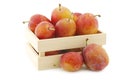 Fresh ripe red and yellow plums in a wooden box Royalty Free Stock Photo