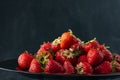 Fresh ripe strawberries Black background, side view. Red berries, seasonal fruits. Sweet mouth-watering strawberry Royalty Free Stock Photo