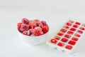 Fresh ripe strawberries frozen in ice cubes on white background. Healthy summer eating Royalty Free Stock Photo