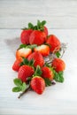 Fresh ripe strawberries on shabby chic white wood plate