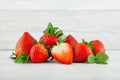 Fresh ripe strawberries on shabby chic white wood plate
