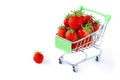 Fresh ripe strawberries in a shopping trolley isolated on a white background. Concept of a supermarket, market, or grocery store. Royalty Free Stock Photo