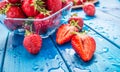 Fresh ripe strawberries washed with water on blue table Royalty Free Stock Photo