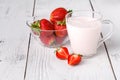 Fresh ripe strawberry in dish on white wooden table Royalty Free Stock Photo