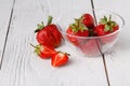 Fresh ripe strawberry in dish on white wooden table Royalty Free Stock Photo