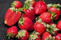 Fresh ripe strawberry with water drops on black Royalty Free Stock Photo