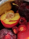 Fresh ripe summer berries and fruits, peaches, apricots, cherry and plum in a round plate on the table Royalty Free Stock Photo