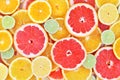 Fresh ripe sweet citrus fruits colorful background: orange, grapefruit, lime, lemon