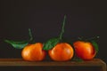 Fresh ripe tangerines, rustic food photography on slate plate kitchen table Royalty Free Stock Photo