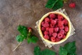 Fresh ripe tasty raspberries in a yellow ceramic bowl. Summer berries. Royalty Free Stock Photo