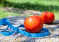 Tomatoes and tape measure Royalty Free Stock Photo