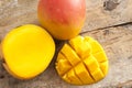 Fresh ripe tropical mango whole and sliced