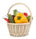 Fresh ripe vegetables and fruit in wicker basket on white background Royalty Free Stock Photo