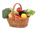 Fresh ripe vegetables and fruit in wicker basket on white background Royalty Free Stock Photo