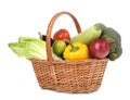 Fresh ripe vegetables and fruit in wicker basket on white background Royalty Free Stock Photo