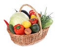 Fresh ripe vegetables and fruit in wicker basket on white background Royalty Free Stock Photo