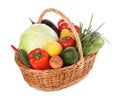 Fresh ripe vegetables and fruit in wicker basket on white background Royalty Free Stock Photo