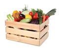 Fresh ripe vegetables and fruit in wooden crate on white background Royalty Free Stock Photo