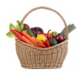 Fresh ripe vegetables and fruits in wicker basket on white background Royalty Free Stock Photo