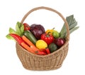 Fresh ripe vegetables and fruits in wicker basket on white background Royalty Free Stock Photo