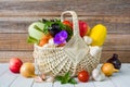 Fresh ripe vegetables in a wicker basket on a wooden table Royalty Free Stock Photo