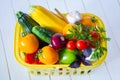 Fresh ripe vegetables in a yellow basket Royalty Free Stock Photo