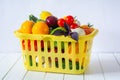 Fresh ripe vegetables in a yellow basket Royalty Free Stock Photo