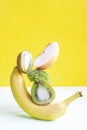Fresh ripe vitamin vegan vegetables and fruits on table. Equilibrium floating food balance on green yellow background, creative Royalty Free Stock Photo