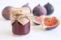 Fresh ripened purple figs. Creative composition a decorative banner of whole and sliced exotic fruit and fig jam Royalty Free Stock Photo