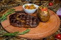 Fresh roast beef meat ribeye steak on wooden plate Royalty Free Stock Photo
