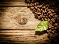 Fresh roast coffee beans on weathered driftwood