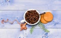 Fresh roasted coffee beans. Cup full coffee brown roasted bean blue wooden background. Caffeine concept. Cafe drinks Royalty Free Stock Photo