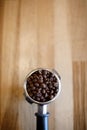 Fresh roasted coffee beans in an espresso filter