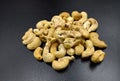 Fresh roasted peanuts served on a black plate Royalty Free Stock Photo