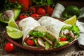 Fresh roll shawarma doner with meat, avocado, cherry tomatoes,