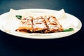 Fresh rolled stuffed crepes on plate Royalty Free Stock Photo