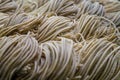 Fresh rolled wheat pasta spaghetti at the market Royalty Free Stock Photo