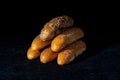 Fresh rolls on dark background. Poppy seed roll and sesame seed roll. Typical popular czech breakfast rolls or buns Royalty Free Stock Photo