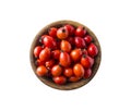 Fresh rosehip berries on white background. Top view. Rosehip berries in a bowl isolated on white background.