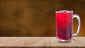 Fresh Roselle juice sweet water and iced in glass on wooden table with dark background, Summer health drinks with ice, Red juice Royalty Free Stock Photo