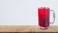 Fresh Roselle juice sweet water and iced in glass on wooden table with white background, Summer health drinks with ice, Red juice Royalty Free Stock Photo