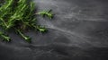 fresh rosemary herbs arranged on a dark stone background, providing ample copy space for a menu or recipe, captured in a Royalty Free Stock Photo