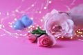 Fresh roses on a pink background, hearts, illumination, concept of romantic congratulations on Valentine`s Day, happy birthday car Royalty Free Stock Photo