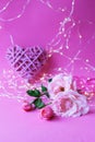 Fresh roses on a pink background, hearts, illumination, concept of romantic congratulations on Valentine`s Day, happy birthday car Royalty Free Stock Photo