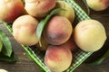 Fresh rosy peaches in a basket Royalty Free Stock Photo
